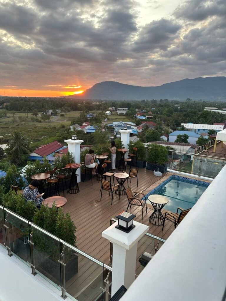 Open-air pool area with views of Bokor Mountain.